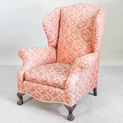 Lot 165 - An early 20th century upholstered wing back...