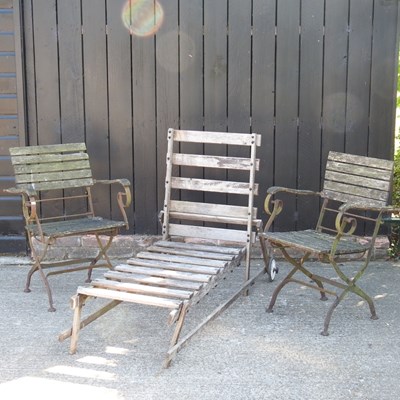 Lot 199 - A pair of folding green garden chairs,...