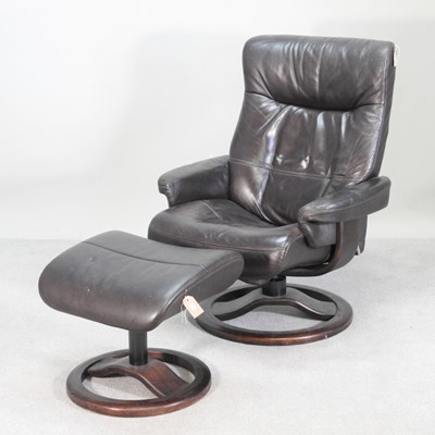 Lot 384 - A stressless style leather swivel reclining...