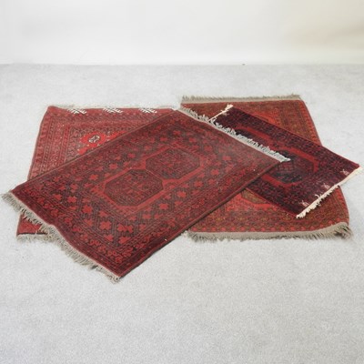 Lot 369 - A bokhara rug, on a red ground, 118 x 61cm,...