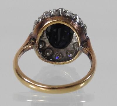 Lot 70 - An unmarked sapphire and diamond cluster ring