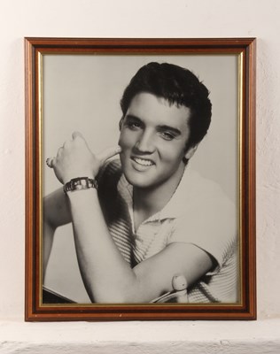 Lot 773 - A black and photograph of Elvis Presley, framed