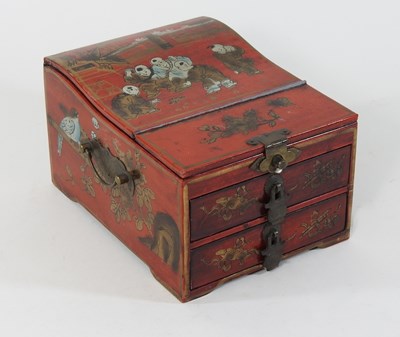 Lot 150 - A Chinese style red lacquered jewellery box