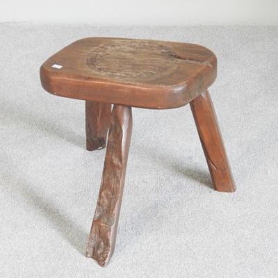 Lot 336 - A rustic wooden milking stool