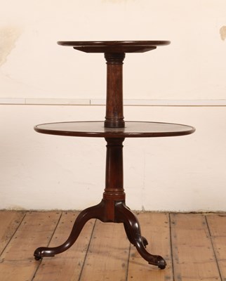 Lot 95 - A George III mahogany dumbwaiter, on a gun...