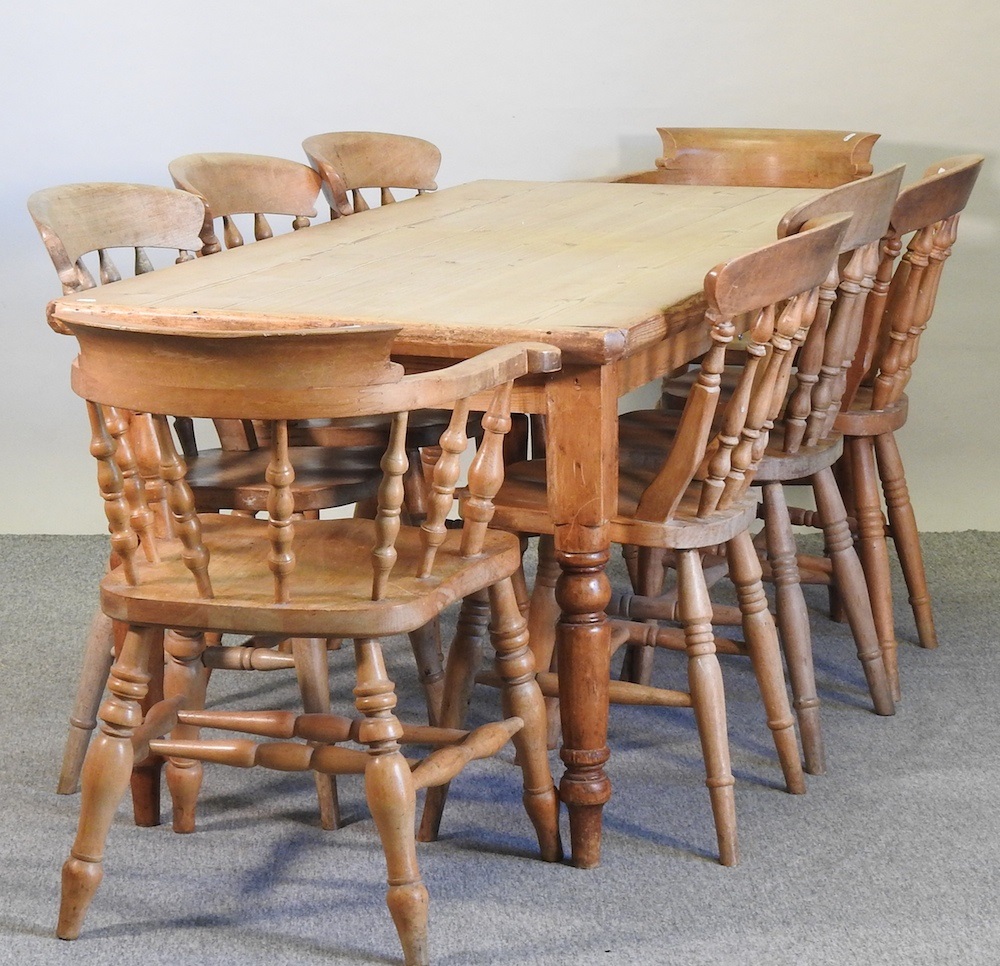 Lot 400 An antique pine dining table