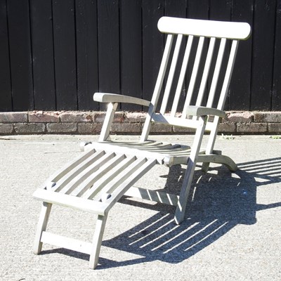 Lot 55 - A teak folding garden lounger, with cushion