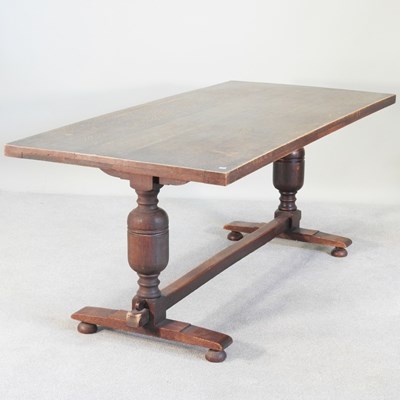 Lot 478 - A mid 20th century oak refectory table, on a...