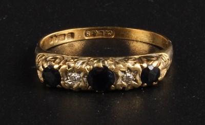 Lot 317 - A 9 carat gold sapphire and diamond ring,...
