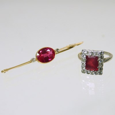 Lot 211 - A 9 carat gold diamond and gem set cluster...