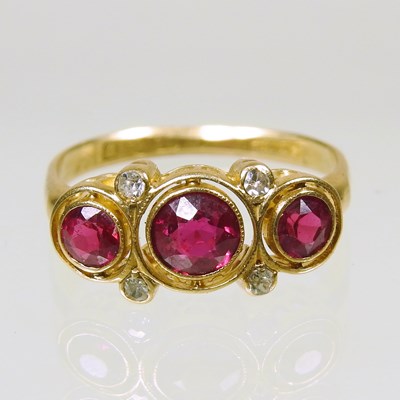 Lot 191 - An 18 carat gold ruby and diamond cluster ring,...
