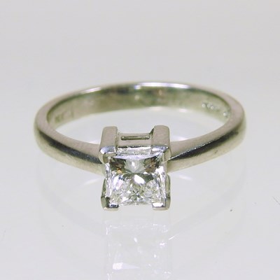 Lot 254 - A platinum and diamond ring, the princess cut...