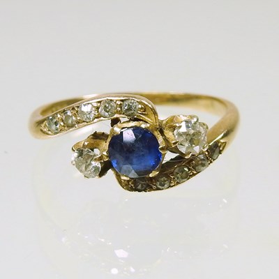 Lot 245 - An 18 carat gold sapphire and diamond three...
