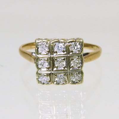 Lot 303 - A 9 carat gold and diamond square set cluster...