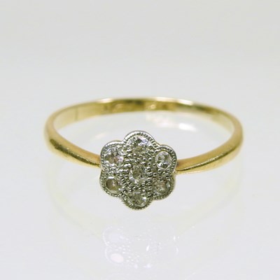Lot 318 - An 18 carat gold and platinum set diamond...