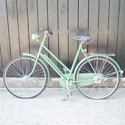 Lot 379 - A vintage Triumph green ladies bicycle