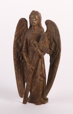 Lot 502 - A brass figure of an angel, shown standing...