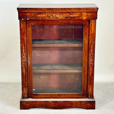 Lot 556 - A 19th century walnut pier cabinet, enclosed...