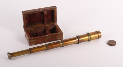 Lot 835 - A brass three-draw telescope, in a fitted...