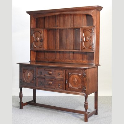 Lot 609 - A 1930's Jacobean style oak dresser