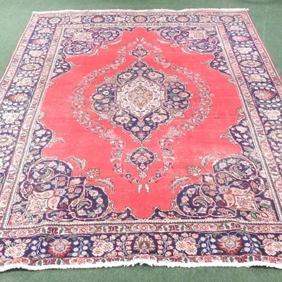 Lot 612 - A Persian woollen carpet