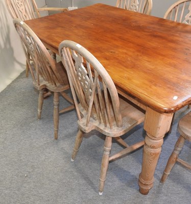 Lot 407 - A stained pine dining table