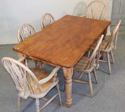 Lot 407 - A stained pine dining table