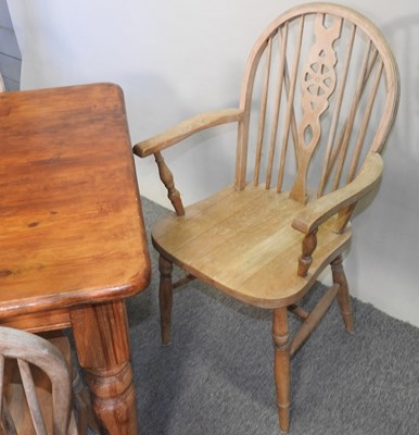 Lot 407 - A stained pine dining table