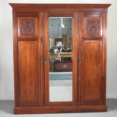 Lot 617 - An Edwardian mahogany triple wardrobe