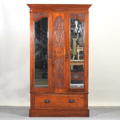 Lot 618 - A late Victorian walnut wardrobe