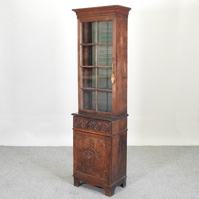 Lot 625 - A 19th century carved oak cabinet bookcase