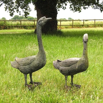 Lot 305 - A weathered metal garden model of a goose