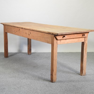 Lot 412 - An antique pine dining table