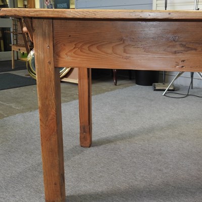 Lot 412 - An antique pine dining table