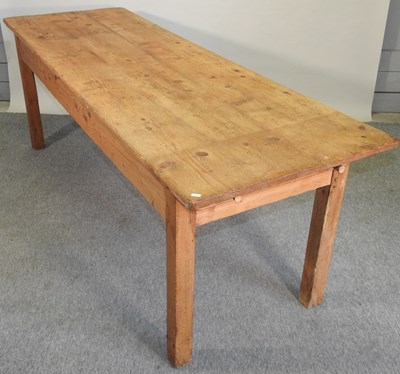 Lot 412 - An antique pine dining table