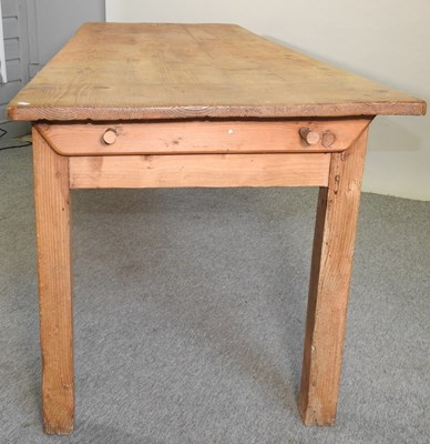 Lot 412 - An antique pine dining table