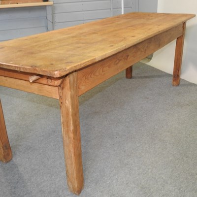 Lot 412 - An antique pine dining table