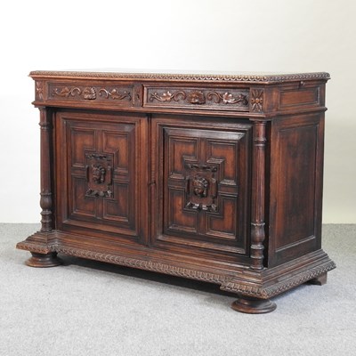 Lot 630 - A 19th century carved oak side cabinet