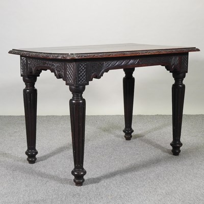 Lot 635 - A 19th century carved oak centre table