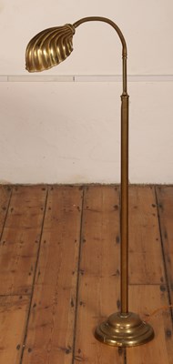 Lot 710 - An Art Deco brass standard lamp, the shade in...