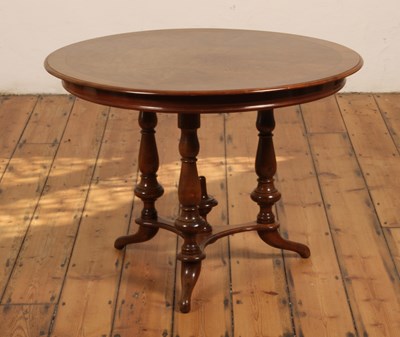 Lot 651 - A circular walnut centre table