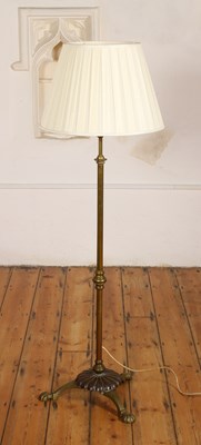 Lot 687 - An early 20th century brass standard lamp,...