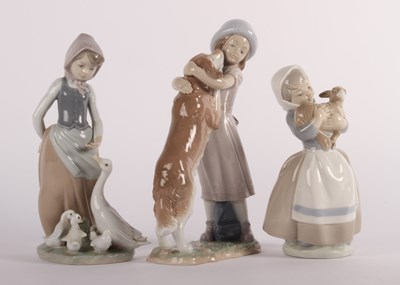 Lot 771 - A group of Lladro and Nao porcelain figures, A...