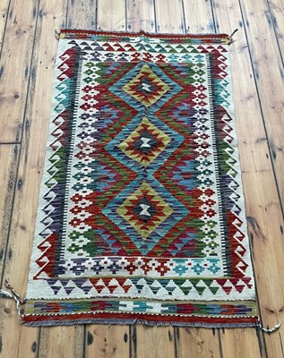 Lot 421 - A Chobi kilim, of colourful geometric design