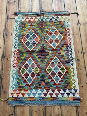 Lot 737 - A Chobi kilim rug, of colourful geometric design