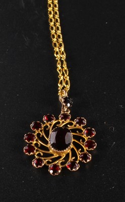 Lot 185 - A 9 carat yellow gold garnet pendant and chain,...