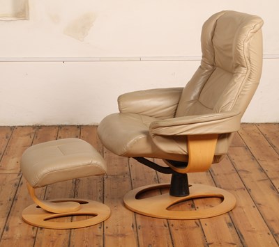 Lot 544 - A John Lewis beige leather upholstered swivel...