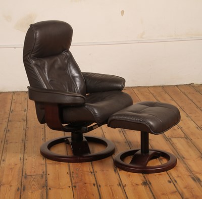 Lot 540 - A John Lewis brown leather upholstered swivel...
