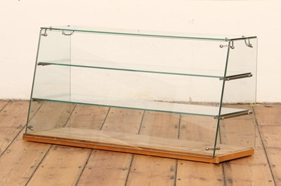 Lot 829 - A glass shop or cafe display case, having a...