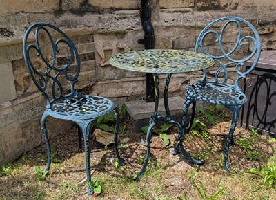 Lot 706 - A metal garden bistro table and chairs set